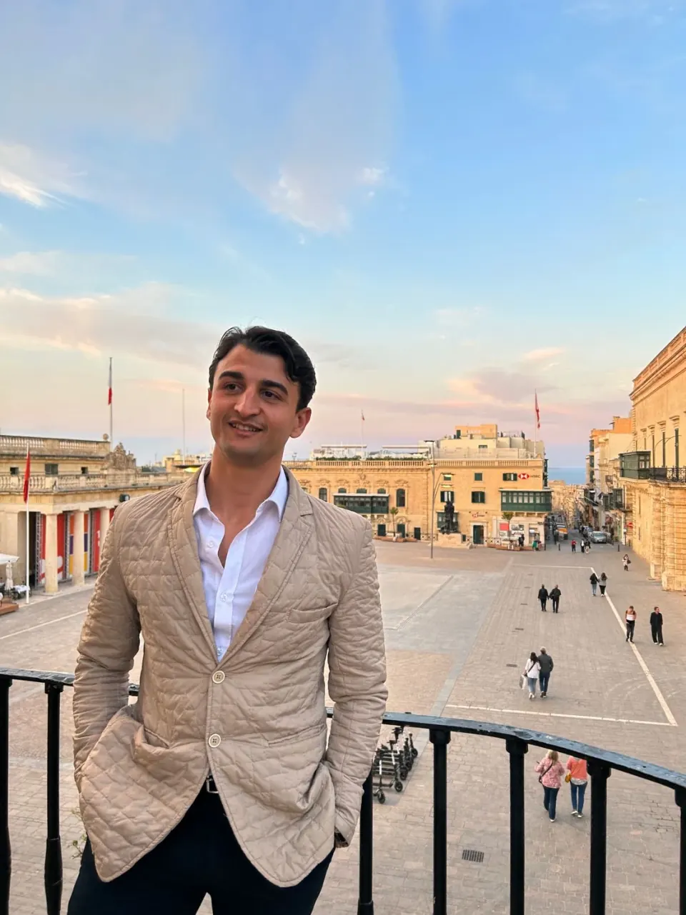Giovanni Mulè on a balcony above a square in Valletta, Malta